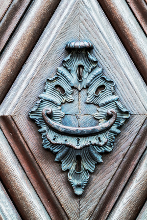 Vintage Doorknob on an old wooden door in Germany, Europeの写真素材