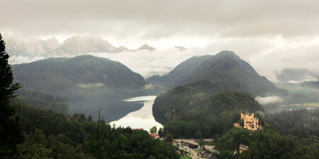 Lovely landscape picture in the South of Bavaria, Germany. September Autumn Scenery with view on the Mountains, a lake and a medieval castle near Munichのeditorial素材