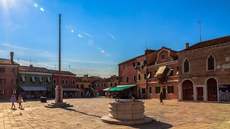 BURANO, ITALY - SEPTEMBER 09 2013: Colorful Houses of Burano. Tourism Island in the Lagoon of Venice. Evening Atmosphere on a warm late summer dayのeditorial素材