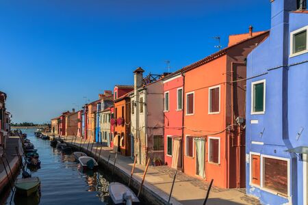 BURANO, ITALY - SEPTEMBER 09 2013: Colorful Houses of Burano. Tourism Island in the Lagoon of Venice. Evening Atmosphere on a warm late summer dayのeditorial素材