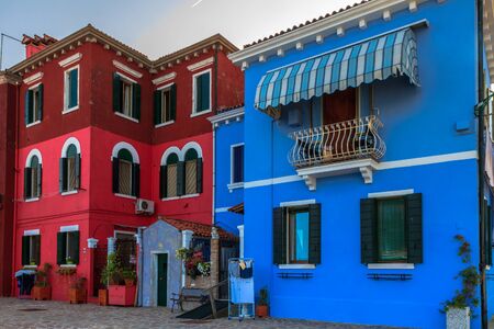 BURANO, ITALY - SEPTEMBER 09 2013: Colorful Houses of Burano. Tourism Island in the Lagoon of Venice. Evening Atmosphere on a warm late summer dayのeditorial素材