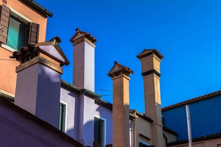 BURANO, ITALY - SEPTEMBER 09 2013: Colorful Houses of Burano. Tourism Island in the Lagoon of Venice. Evening Atmosphere on a warm late summer dayのeditorial素材