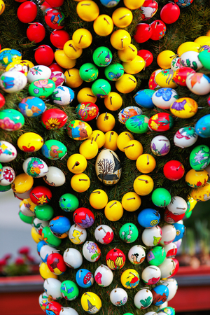 Franconian Easter Tradition. Masterfully Colored Easter Eggs on a decorated Easter Well. Old german pagan spring ritual of well and water blessingの写真素材