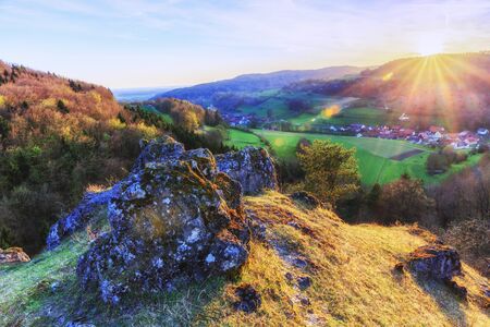 Sunset in the jurassic hills of Upper Franconia, Germany. Lovely Spring evening in the rural countryside near Bamberg. European Sceneryの写真素材