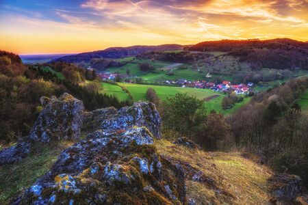 Sunset in the jurassic hills of Upper Franconia, Germany. Lovely Spring evening in the rural countryside near Bamberg. European Sceneryの写真素材