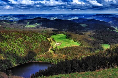 Feldberg Mountain in Germany in Spring. Lovely Hills and Forests. Blue cloudy sky. Fantastic Landscapeの写真素材