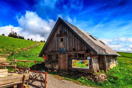 Feldberg GERMANY MAY 17 2015: Mountain Hut at Feldberg mountain in Germany in Spring. Lovely Hills and Forests. Blue cloudy sky. Fantastic Landscapeのeditorial素材