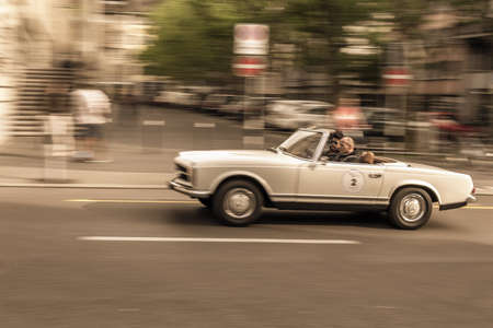 ZURICH SWITZERLAND MAY 14 2015: Inner City of Zurich Switzerland. Old Town at the river. Fast Car on the Street. Sepia Colorのeditorial素材