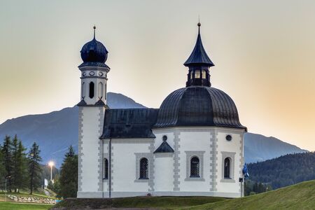 Seefeld Church in Tyrol, Austria on a warm late summer eveningの写真素材