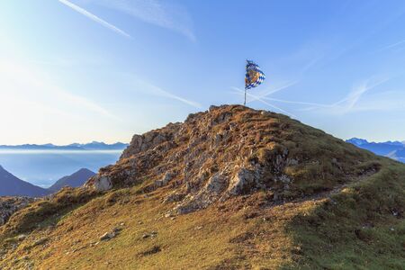 Eastern Karwendel High Mountains in Austria in Tyrol. Countryside Adventure Landscape with narrow trekking trails for mountaineering and hiking through the Austrian High Land near Seefeld on a warm and sunny August day with clear sky.の写真素材