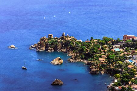 Fantastic Landscape at the italien sicilian Coastal City of Cefalu. Warm summer colors. Lovely sea and mediterranean historical houses. Lovely Sight and european travel destination in Italyの写真素材