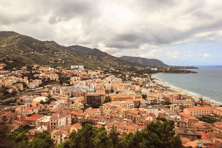 Fantastic Landscape at the italien sicilian Coastal City of Cefalu. Warm summer colors. Lovely sea and mediterranean historical houses. Lovely Sight and european travel destination in Italyの写真素材