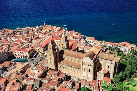 Fantastic Landscape at the italien sicilian Coastal City of Cefalu. Warm summer colors. Lovely sea and mediterranean historical houses. Lovely Sight and european travel destination in Italyの写真素材