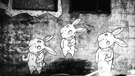 PALERMO, ITALY - SEPTEMBER 12 2015: White Graffiti on Wall. Black and White image in the sicilian capital of Palermo, Italy Europeのeditorial素材