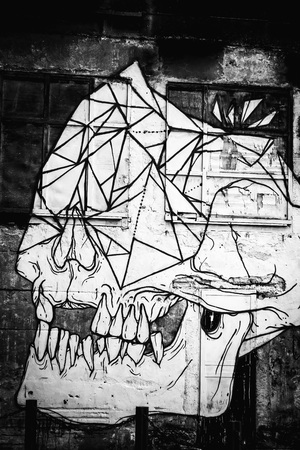 PALERMO, ITALY - SEPTEMBER 12 2015: White Graffiti on Wall. Black and White image in the sicilian capital of Palermo, Italy Europeのeditorial素材