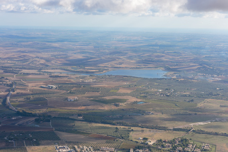 Sicilian Landscape at the Erice Mountain near Trapani, Italy. Hot autumn afternoon with some clouds. Warm colors and lovely sky. Popular travel destinationの写真素材