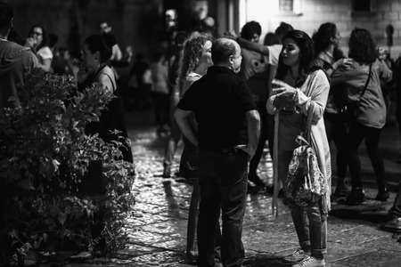 PALERMO, ITALY - OCTOBER 01 2015: Open Dance Night with traditional dances at the Piazza Pretoria in Palermo, Sicily.Night High ISO Black and White Photography with low depth of field and noiseのeditorial素材