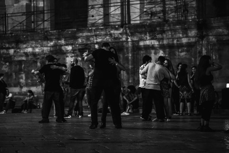 PALERMO, ITALY - OCTOBER 01 2015: Open Dance Night with traditional dances at the Piazza Pretoria in Palermo, Sicily.Night High ISO Black and White Photography with low depth of field and noiseのeditorial素材