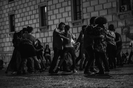 PALERMO, ITALY - OCTOBER 01 2015: Open Dance Night with traditional dances at the Piazza Pretoria in Palermo, Sicily.Night High ISO Black and White Photography with low depth of field and noiseのeditorial素材