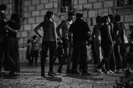 PALERMO, ITALY - OCTOBER 01 2015: Open Dance Night with traditional dances at the Piazza Pretoria in Palermo, Sicily.Night High ISO Black and White Photography with low depth of field and noiseのeditorial素材