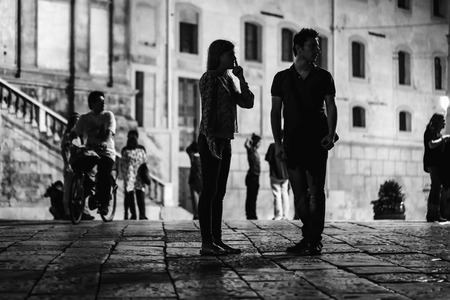 PALERMO, ITALY - OCTOBER 01 2015: Open Dance Night with traditional dances at the Piazza Pretoria in Palermo, Sicily.Night High ISO Black and White Photography with low depth of field and noiseのeditorial素材