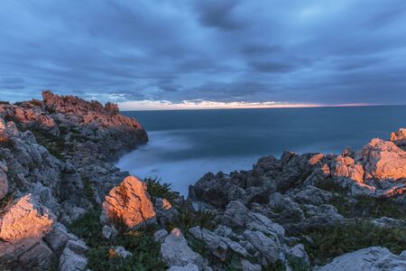 Sicily Coastline in Autumn at Sant Elia near Palermo, Italy. Dramatic clouds and waves at dawn...