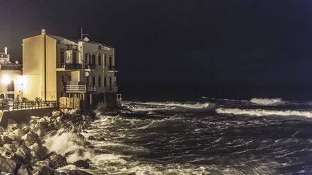 Sicily Coastline in Autumn at Sant Elia near Palermo, Italy. Dramatic clouds and waves at dawn sunrise in October at the seaのeditorial素材