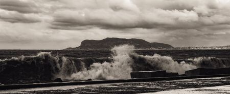 PALERMO, ITALY - NOVEMBER 01 2015: Picture from the stormy and wet November 1st in the sicilian capital of Palermo, Italy. Vintage Sepia Black and White on the stormy coastのeditorial素材