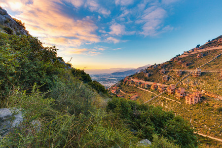 unfinished house ruins raised by the Mafia through corruption on a hill near Palermo. Sicilian Landscape near Mondello, Italyの写真素材