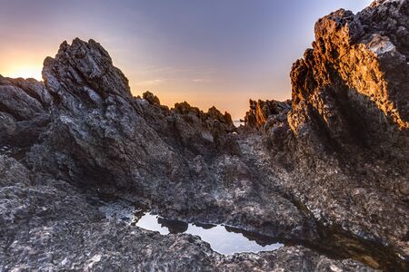 Captivating Coastal Sunset near Palermo on the island of Sicily, Italy. Lovely subtropical winter landscape at the sea. Enchanted Atmosphere in the eveningの写真素材