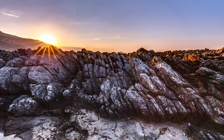 Captivating Coastal Sunset near Palermo on the island of Sicily, Italy. Lovely subtropical winter landscape at the sea. Enchanted Atmosphere in the eveningの写真素材