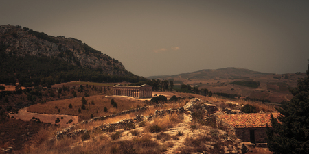 Temple of Segesta in central Sicily. Never completely finished greek antique temple site in Italy, Europe on a hot summer dayの写真素材