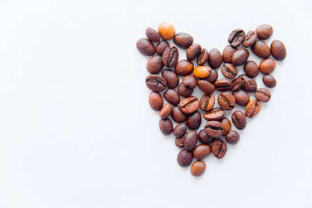 heart from coffee beans on white background.の写真素材