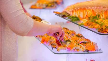 reception: people put food in the dish.の写真素材