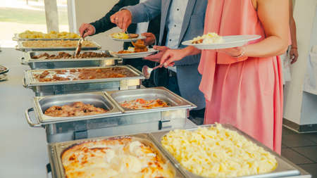 buffet: people take food in plates.