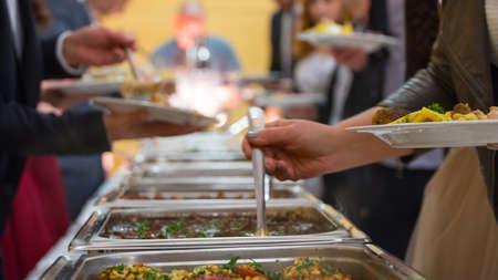 people group catering buffet food indoor in luxury restaurant with meat.