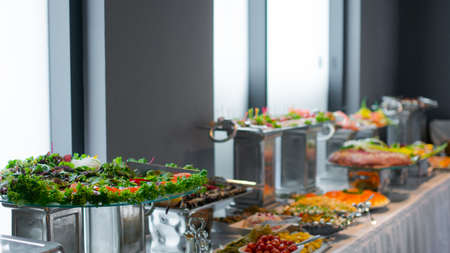 buffet dishes are on the table.