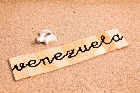 Words FORMED from small pieces of wood container container containing a sun and beach tourist destination Venezuelaの写真素材