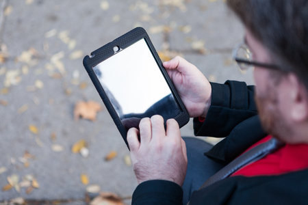 A young businessman reading in His mobile deviceの写真素材
