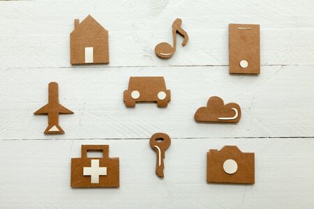 Set of web icons or graphical illustrations cut from cardboard and wooden Placed on white backgroundの写真素材