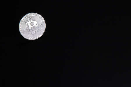 Photograph of bitcoin coins symbolizing the financial market of cryptocurrencies on a colored background and without peopleの写真素材