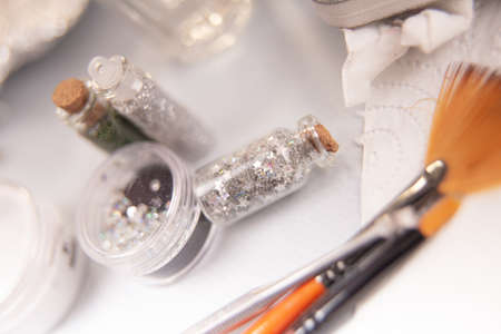 beauty salon. nail brushes, cuticle scissors, nail brocade and nail file on a white backgroundの写真素材