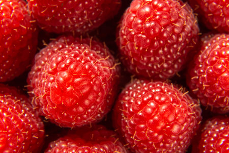 macro photo of rape, organic raspberries. appetizing fruit raspberries in close-up, top view