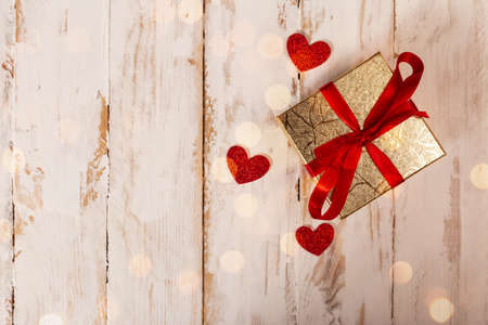 valentine's day gift. a packed gift, red hearts and a place for text. Decoration for February 14の写真素材