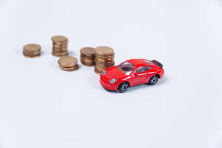 toy car and coins. Savings per car. financing for car loan, cheap car, sell carの写真素材