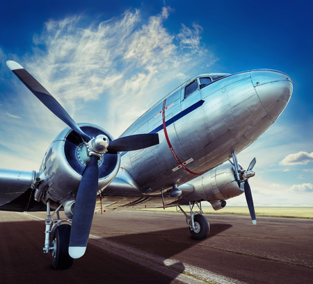 historical aircraft on a runway is waiting for take offの写真素材