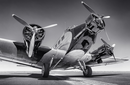historical aircraft on a runwayの写真素材