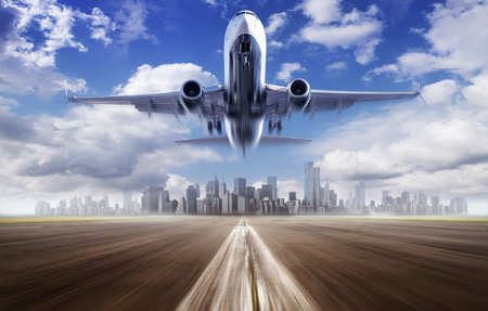take off of a modern airliner against a skylineの写真素材