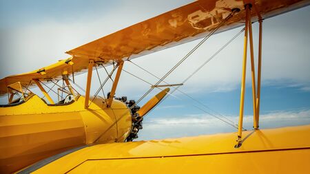 Biplane against a blue skyの写真素材