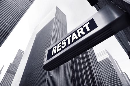 Office building with a restart signの写真素材